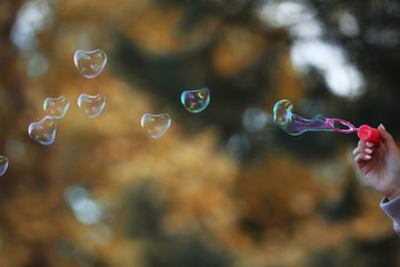 Soap bubbles in heart shape outdoor