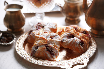 Antique tea-set with Turkish delight and baking on table close-up