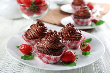 Chocolate cupcakes on plate closeup