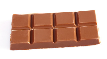 Milk chocolate pieces isolated on white background