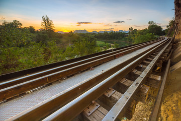 Fototapeta na wymiar Railroad tracks parallel to the steep cliff.