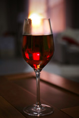 Glass of red wine on blurred background