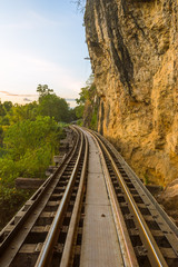 Fototapeta na wymiar Railroad tracks parallel to the steep cliff.