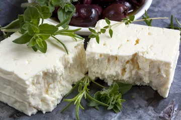 Photo sur Aluminium Produits laitiers Feta Cheese with Black Olives and Fresh Herbs