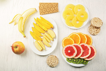 Fruits on light wooden background. healthy eating concept.