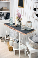 Modern workplace for designer in rustic style, on brick wall background