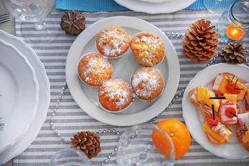 Tasty muffins in a Christmas dinner table