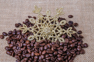 Coffee bean and decoration in the form of snowflakes