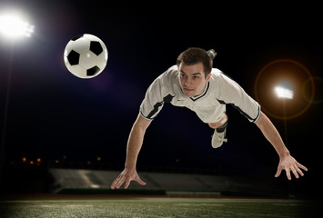 Fototapeta premium Soccer Player hitting the ball