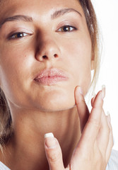 woman with pimple making out close up isolated on white macro