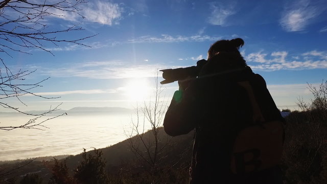 Man photographing mountain