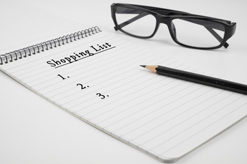 Shopping list is written on notepad.