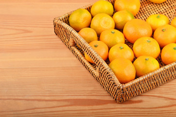Mandarin on wickered tray