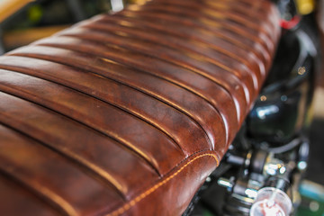 Detail of leather motorcycle seat - obrazy, fototapety, plakaty