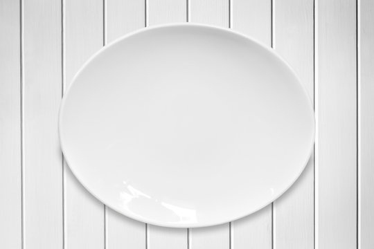 White Oval Plate on White Timber