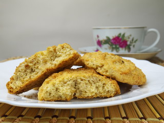 oat cookies on dish and tea cup on the background