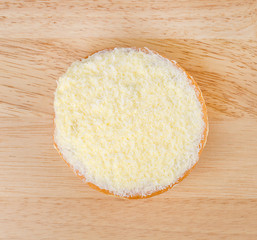 Donut on wooden background.