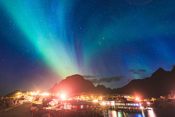 Obraz premium Beautiful picture of massive multicoloured vibrant Aurora Borealis, Aurora Polaris, also know as Northern Lights in the night sky over Norway, Lofoten Islands
