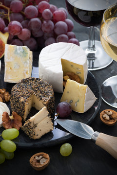 Assorted soft delicacy cheeses and appetizers to wine, vertical
