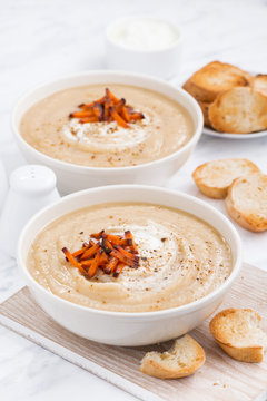 cream soup with caramelized carrots, vertical