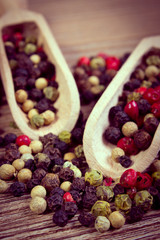 Vintage photo, Fresh colored pepper with spoon on wooden background