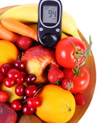 Glucose meter with fruits and vegetables on wooden plate