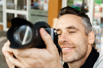 Male photographer taking picture