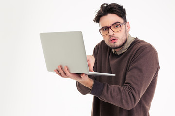 Portrait of a funny man using laptop compter