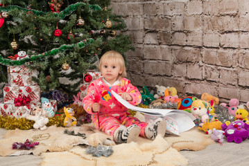 Fototapeta premium A little girl wrote a letter to Santa Claus