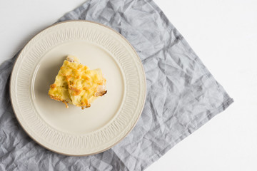 Potato casserole with meat on the wooden table
