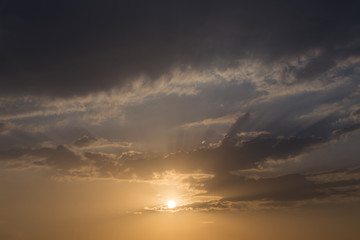 sunset sky background, light rays of sunbeam in evening