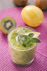 Kiwi and lemon smoothie on pink