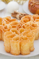 typical portuguese dessert filhos on white plate on white background