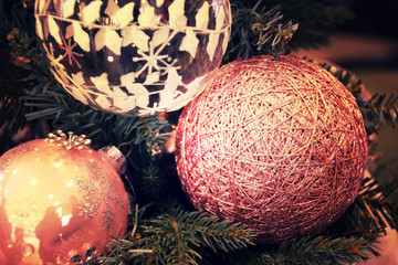 Beautiful christmas decorations hanging on christmas tree proces