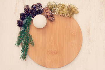 Obraz na płótnie Canvas brown board with Christmas decoration on white background