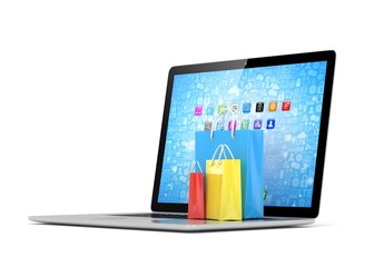 laptop and  shopping pags on white background