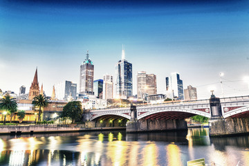 Fototapeta na wymiar Stunning night skyline of Melbourne with river reflections