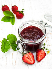 Strawberry jam and fresh strawberries