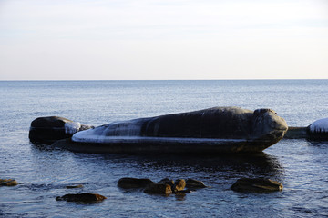 a large rock in the sea