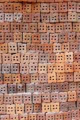 Stack of clay bricks texture background.