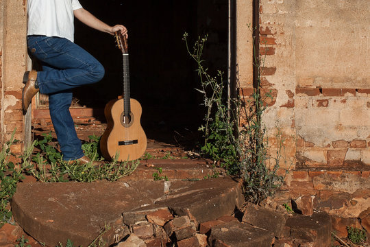 Classical acoustic guitar in ruins of abandoned church at Palmit