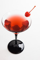 Cocktail in martini glass isolated on white background