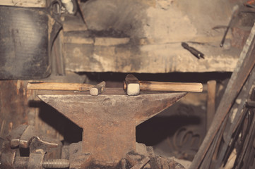 Hammer and anvil, detail of a forge, metal tools