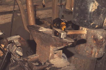 Hammer and anvil, detail of a forge, metal tools