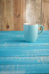 Coffee cup on wooden table.jpg