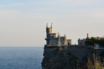 castle 'Swallow's nest' closeup on top of cliff, evening light, Black sea, rocky cape Ai-Todor, Crimea, Russia