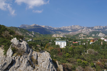 Fototapeta na wymiar top view of township Simeiz and panorama of mountains, Crimea, Russia