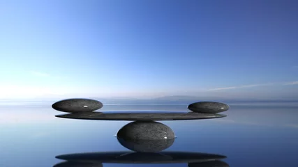  Balancerende Zen-stenen in water met blauwe lucht en vredig landschap. © viperagp