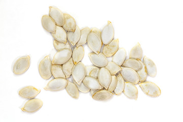 Pumpkin seeds on the white background