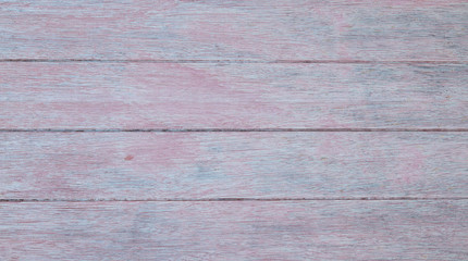 Naklejka premium Closeup of pale grey wooden horizontal planks with red and blue tints